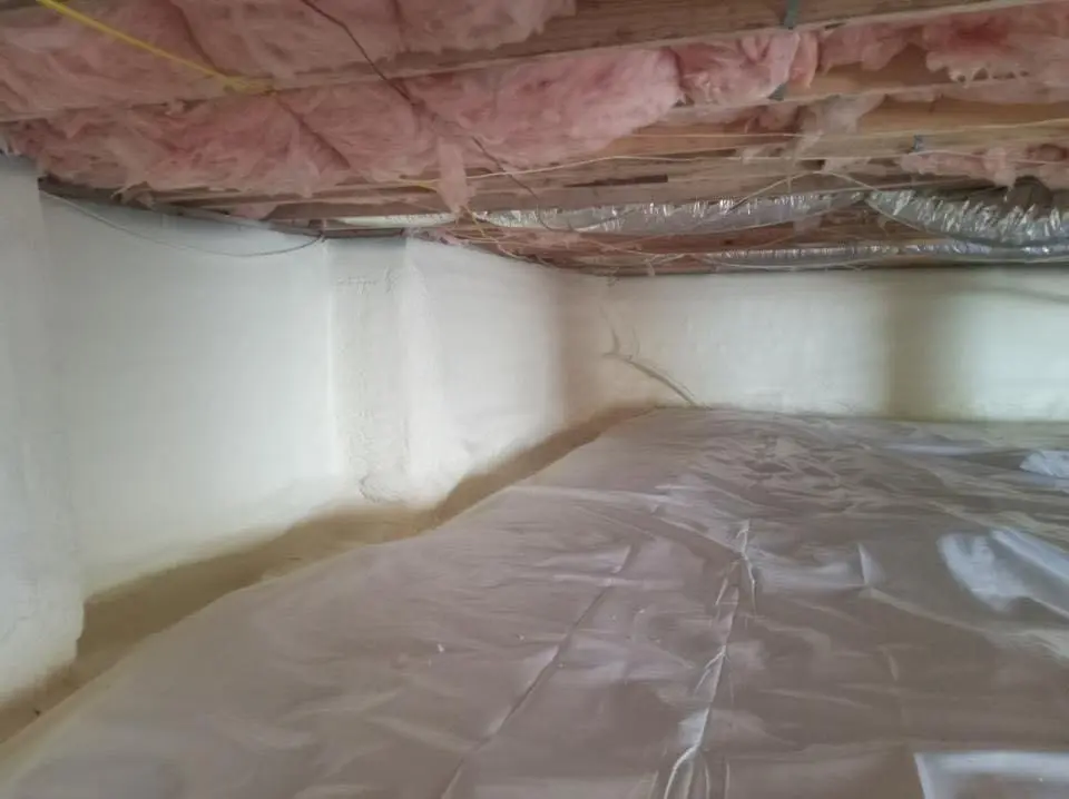 Crawl space encapsulation with closed-cell spray foam for Commercial Roof Restoration in Jackson